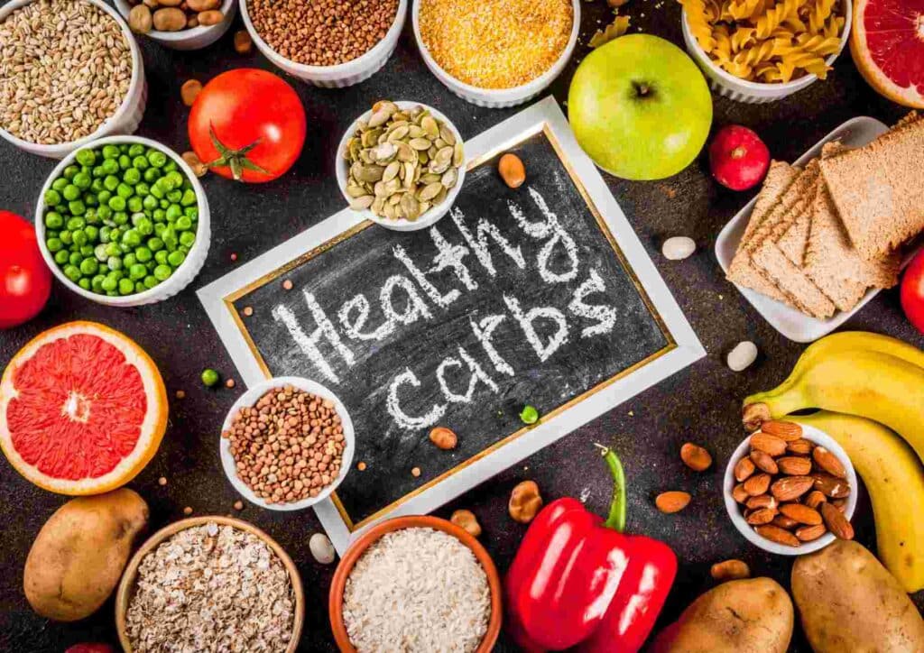 Nutrition For Runners 3 A blackboard displaying various healthy carbohydrate options, including grains, fruits, and vegetables.