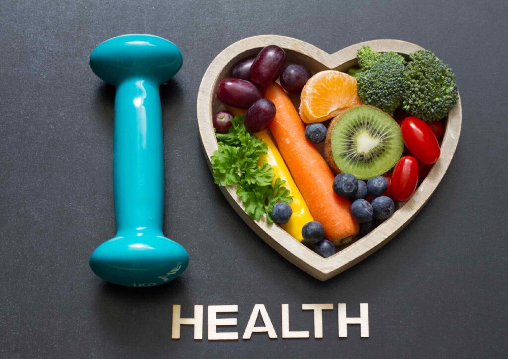 High Protein Banana Smoothie For Weight Loss 6 A vibrant display of fresh fruits, vegetables, and fitness equipment, symbolising a commitment to health and wellness.