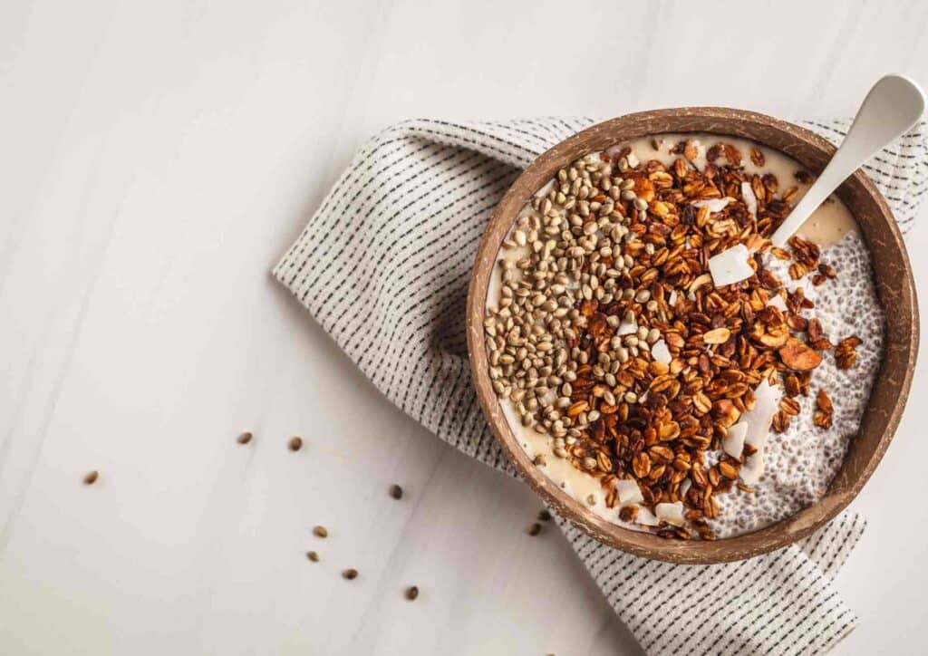 Is Breakfast the Most Important Meal of the Day? 4 A bowl containing chia seeds and oats placed on a white table surface.