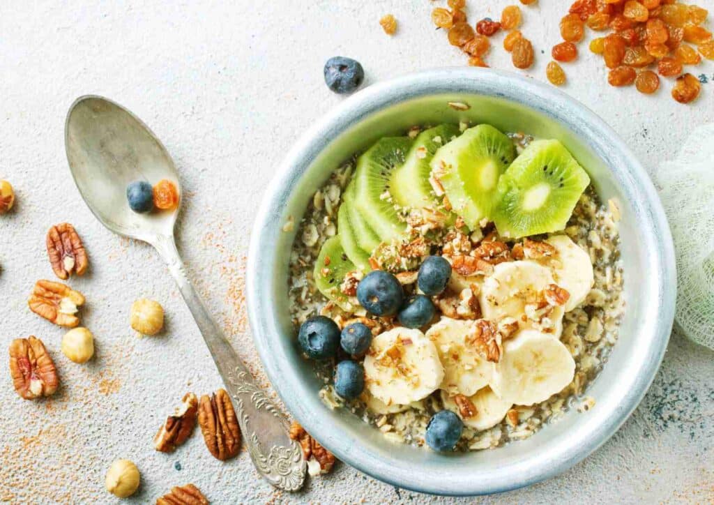 Is Breakfast the Most Important Meal of the Day? 8 A bowl of oats topped with sliced bananas, fresh blueberries, and a sprinkle of nuts for added texture and flavour.