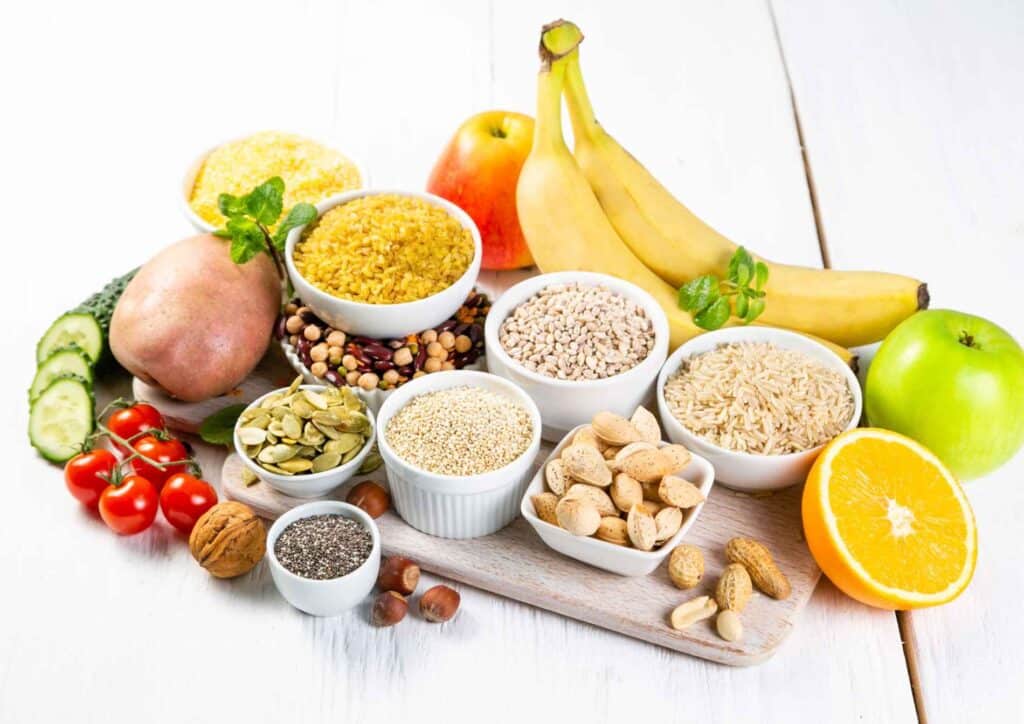 Is Breakfast the Most Important Meal of the Day? 6 A colourful assortment of fruits and vegetables displayed on a wooden table, showcasing their vibrant colours and textures.