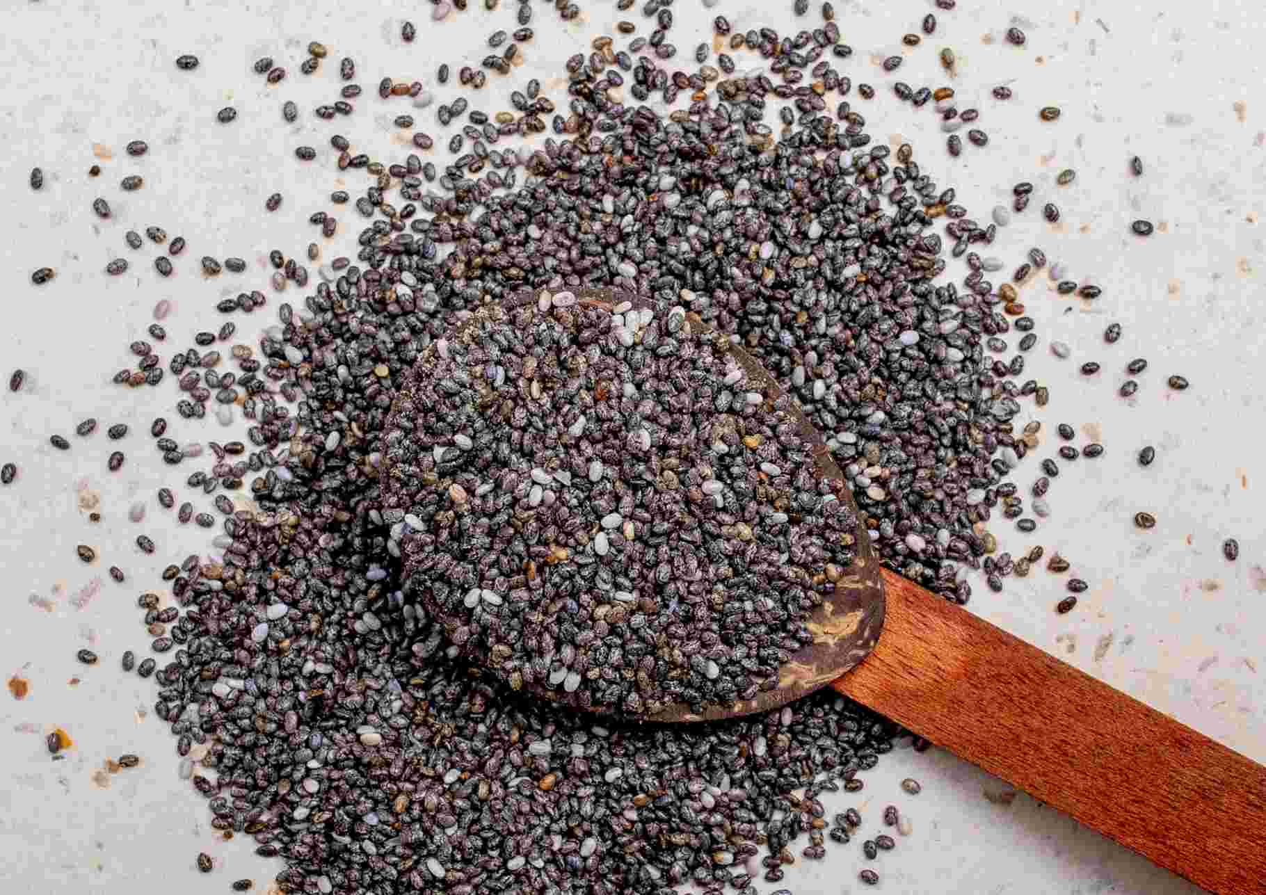 Do Chia Seeds Help With Weight Loss? 14 Chia seeds displayed in a small bowl, highlighting their texture and color, known for being rich in omega-3 fatty acids.