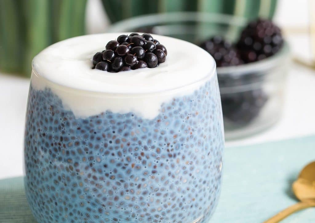 Do Chia Seeds Help With Weight Loss? 10 A bowl of blackberry chia pudding topped with fresh blackberries and mint leaves, showcasing a creamy texture and vibrant colour.