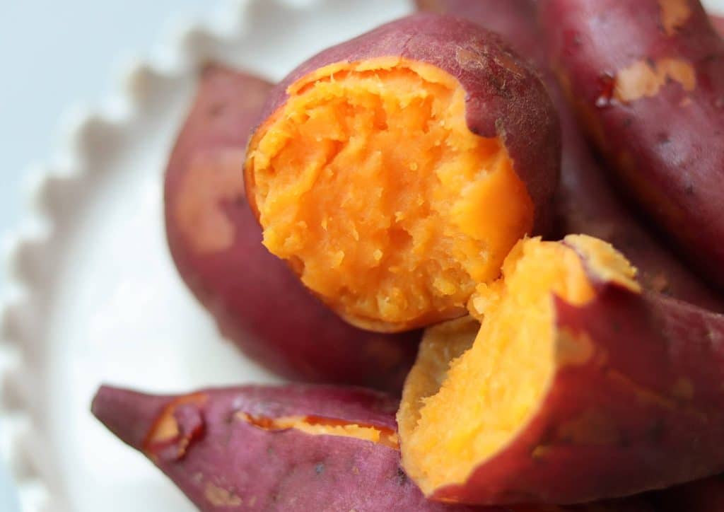 Is Sweet Potato Good for Weight Loss? 19 Chopped sweet potatoes arranged on a white plate, showcasing their vibrant orange colour and smooth texture.