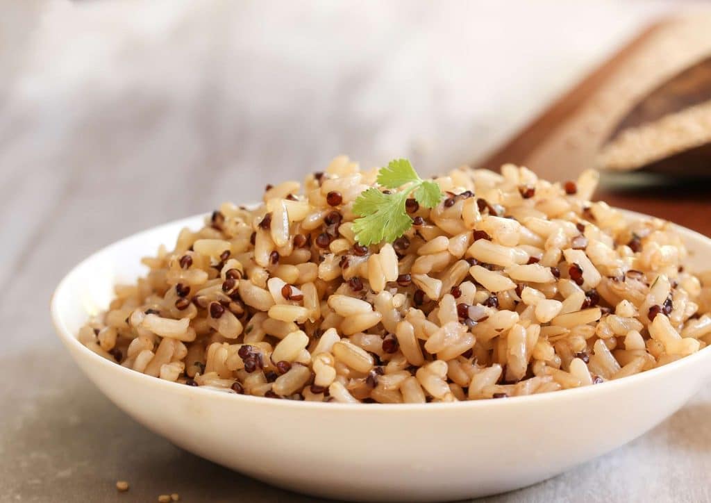 The Best Foods for Weight Loss 23 Brown rice in a bowl, highlighting its texture, representing a nutritious source of fibre and protein.