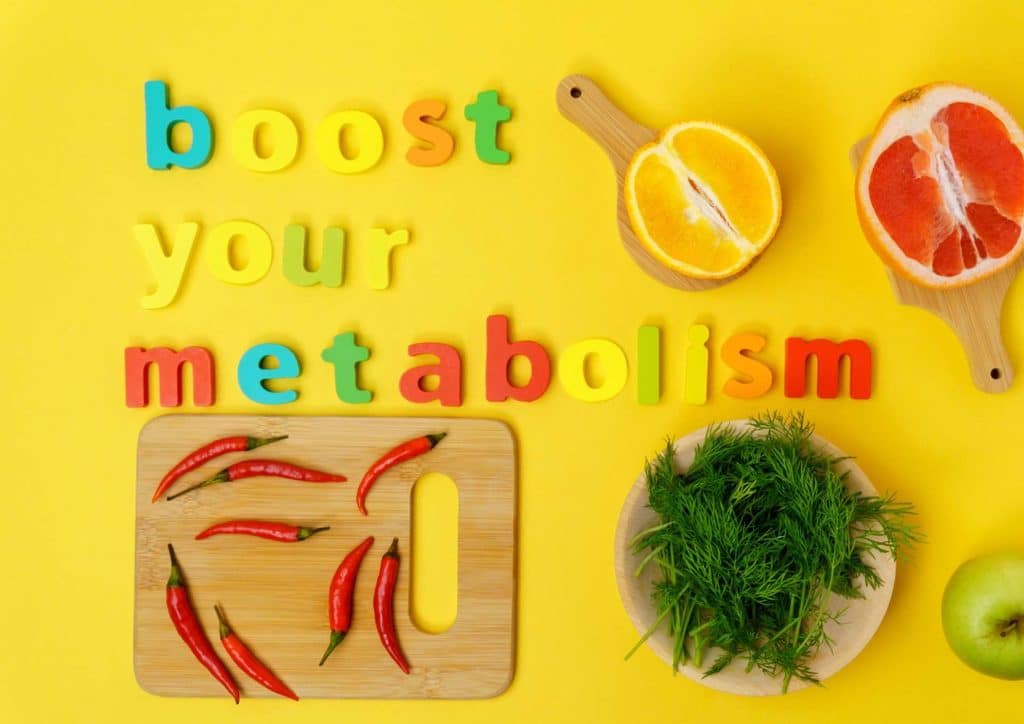 What Is Sustainable Weight Loss? 28 A variety of healthy foods, including fruits, vegetables, and nuts, arranged to promote metabolism-boosting benefits.