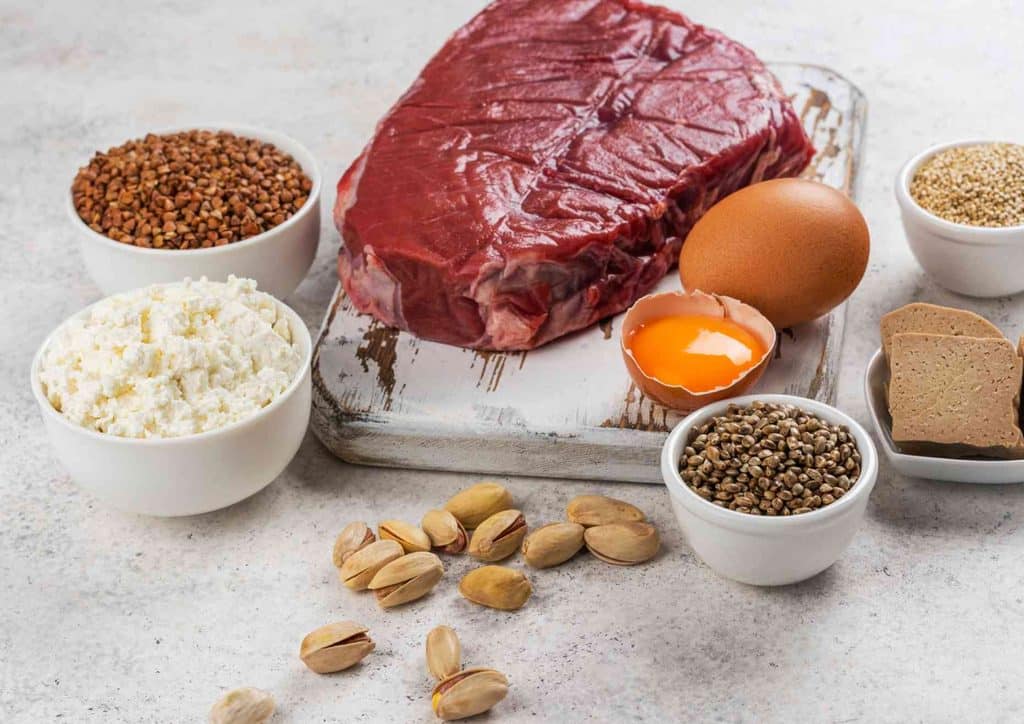 Natural Alternatives to Ozempic for Weight Loss 11 A variety of fresh fruits, vegetables, whole grains, and lean proteins arranged on a wooden table, promoting a healthy diet.