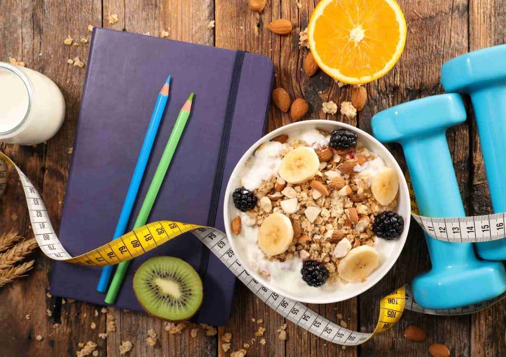 How to Lose Weight Without Exercise 15 A table featuring various nutritious breakfast dishes, such as smoothies, eggs, and whole grains, ideal for weight loss.
