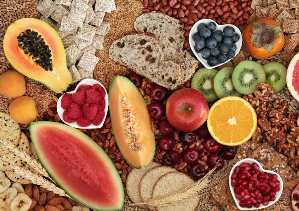 How to Lose Weight Fast (Safely, Without Crashing) 13 A colorful assortment of fruits and vegetables displayed in bowls, showcasing a variety of shapes and colours.