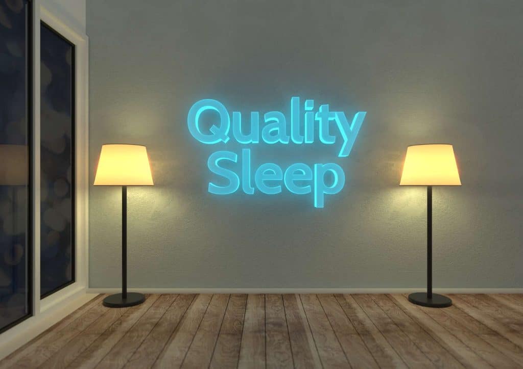 How to Speed Up Your Metabolism (What Actually Works) 17 Neon sign reading "Quality Sleep" illuminated in a cozy bedroom setting.