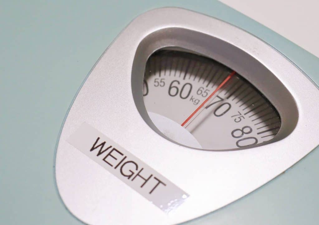 Why Am I Not Losing Weight? 8 Reasons a Nutritionist Sees Every Week 20 A weight scale displaying the word "weight" prominently on its surface.