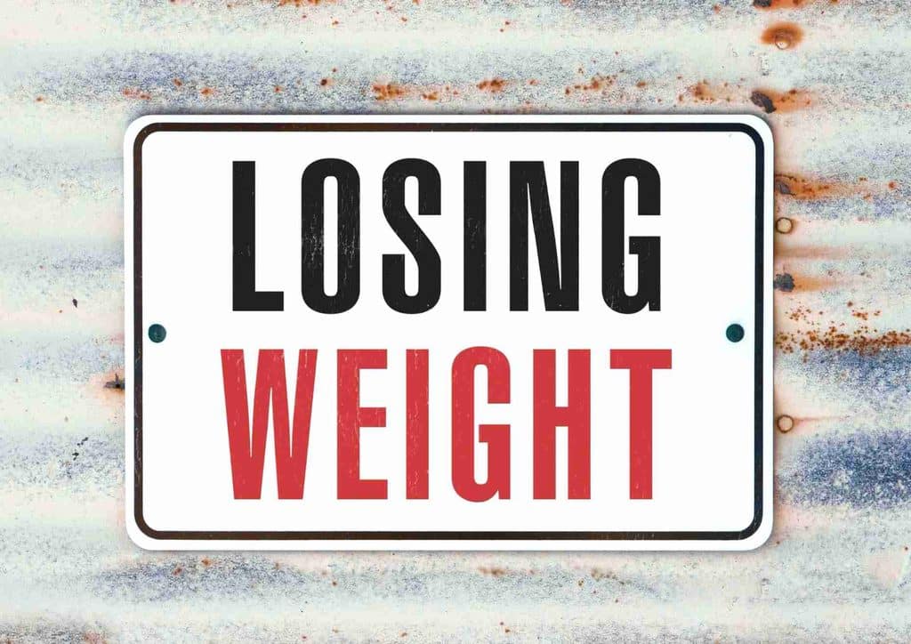 Losing Weight While Breastfeeding: What's Safe and Realistic 6 A graphic illustrating quick weight loss tips, featuring healthy foods, exercise routines, and hydration advice.
