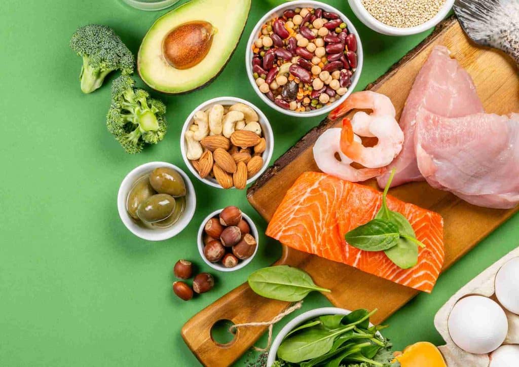 Is the Mediterranean Diet Good for Weight Loss? 2 A variety of heart-healthy foods including fruits, vegetables, whole grains, and nuts displayed on a wooden table.