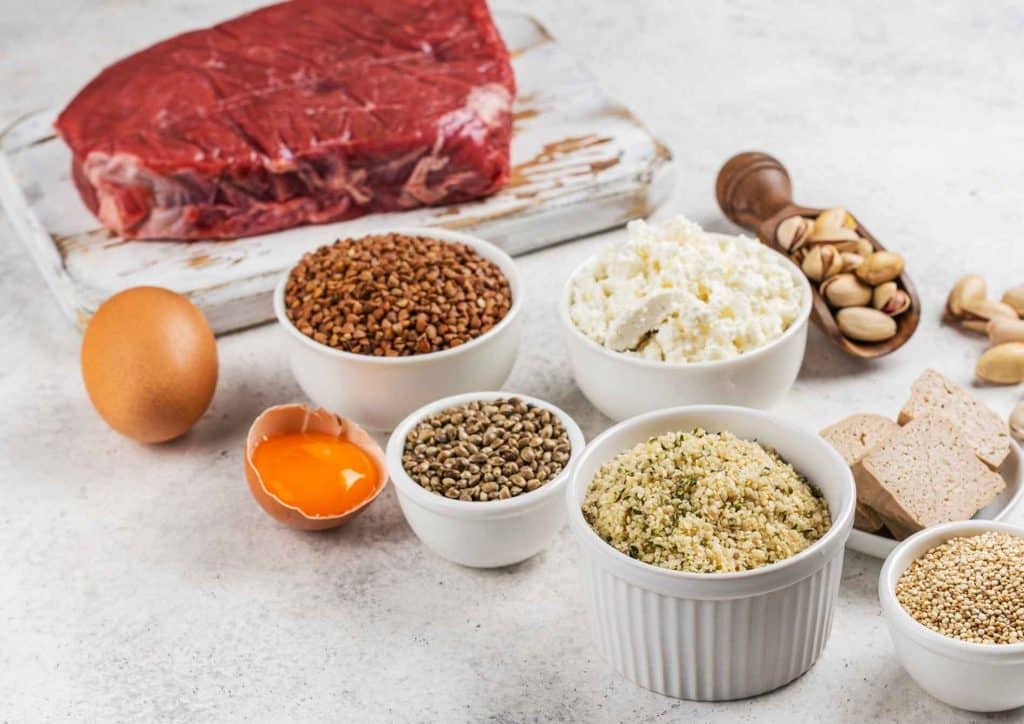 Is Whey Protein Good for Weight Loss? 40 A variety of fresh fruits, vegetables, whole grains, and lean proteins arranged on a wooden table, promoting a healthy diet.
