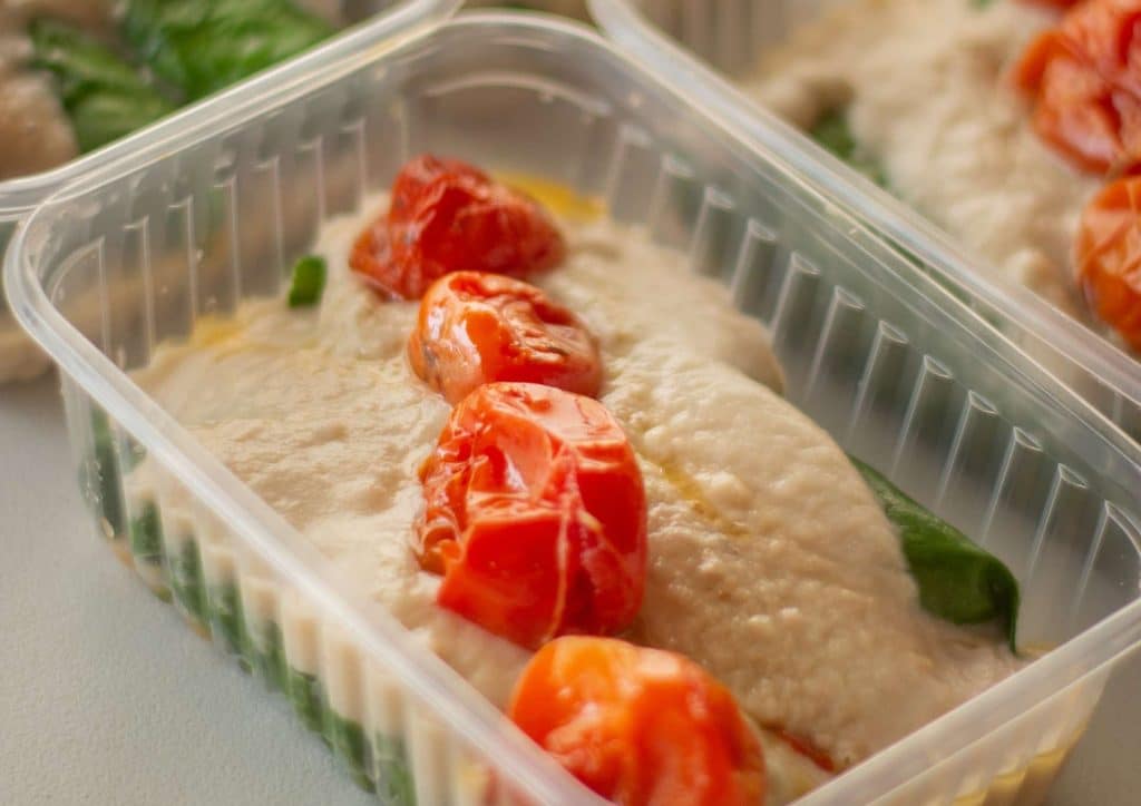 Easy Meals for Weight Loss When You're Short on Time 50 Three clear plastic containers filled with various types of food, arranged neatly on a countertop.