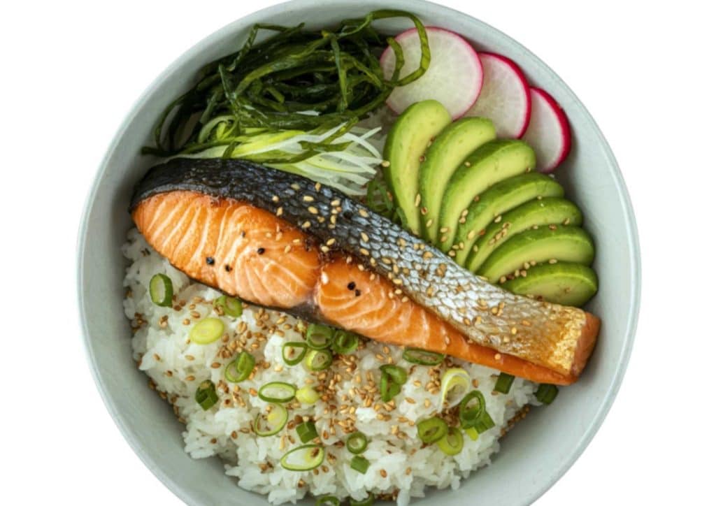 Healthy Dinners for Weight Loss: Easy Weeknight Ideas 27 A bowl filled with salmon, rice, and assorted vegetables, showcasing a colourful and nutritious meal.