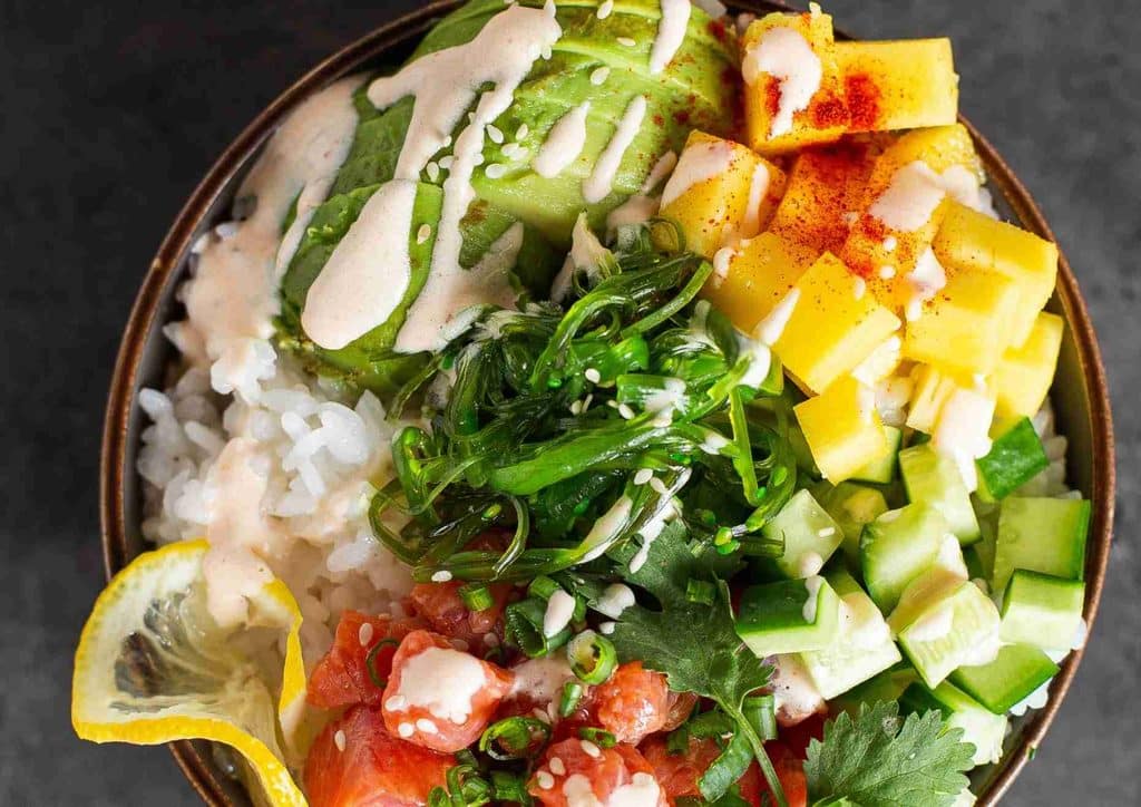 Easy Meals for Weight Loss When You're Short on Time 44 A bowl filled with rice, assorted vegetables, and a savory sauce, showcasing a colourful and appetising meal.
