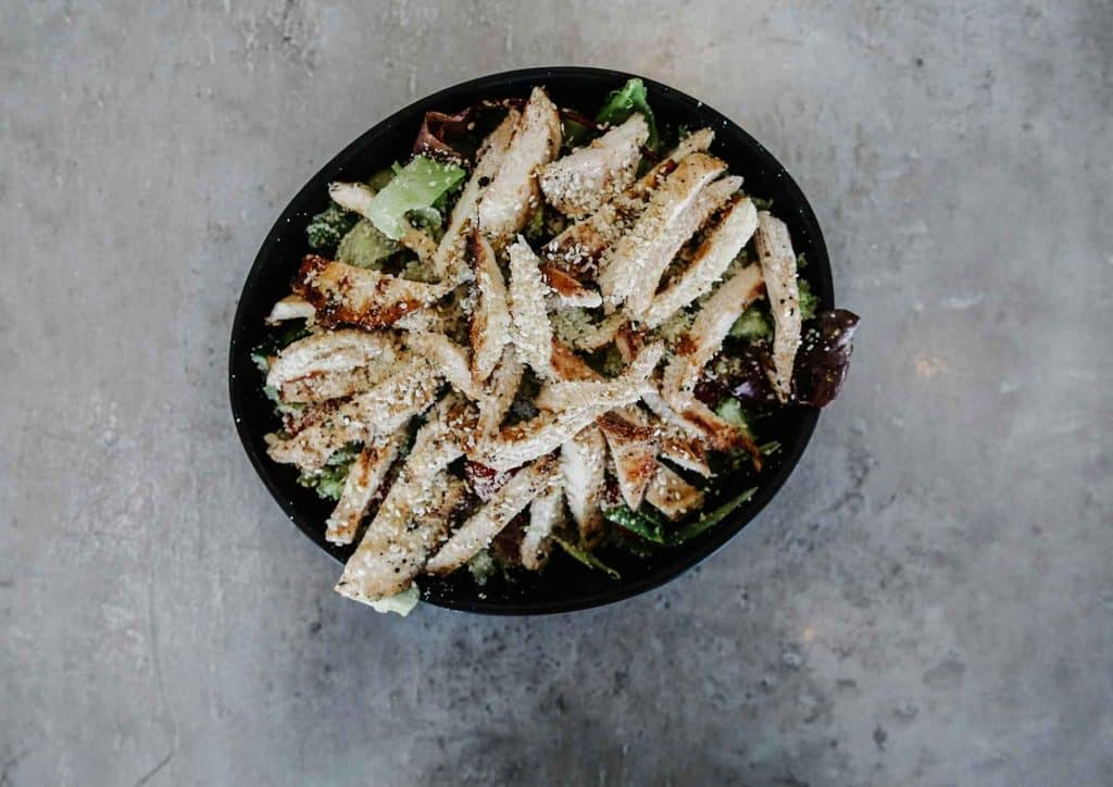 Healthy Dinners for Weight Loss: Easy Weeknight Ideas 30 A plate of chicken salad featuring shredded chicken, fresh lettuce, and a drizzle of dressing.