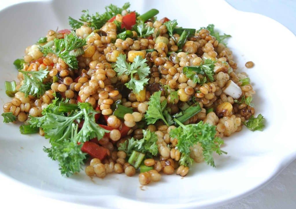 Healthy Dinners for Weight Loss: Easy Weeknight Ideas 31 A bowl filled with colourful vegetables and fresh herbs, showcasing a healthy and vibrant meal.