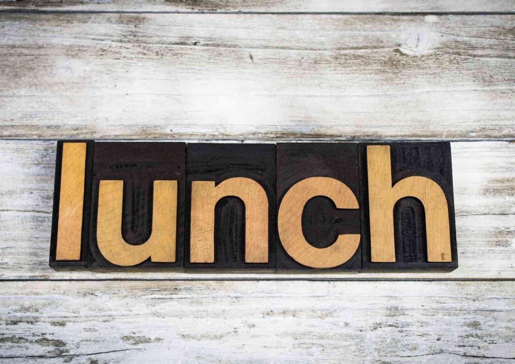 Healthy Lunches for Weight Loss: Work and Home Ideas 47 The word "lunch" formed from wooden type letters on a white background.