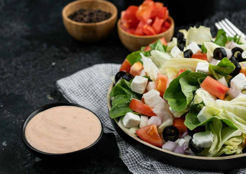 Healthy Lunches for Weight Loss: Work and Home Ideas 34 A vibrant salad bowl filled with lettuce, tomatoes, and assorted vegetables.