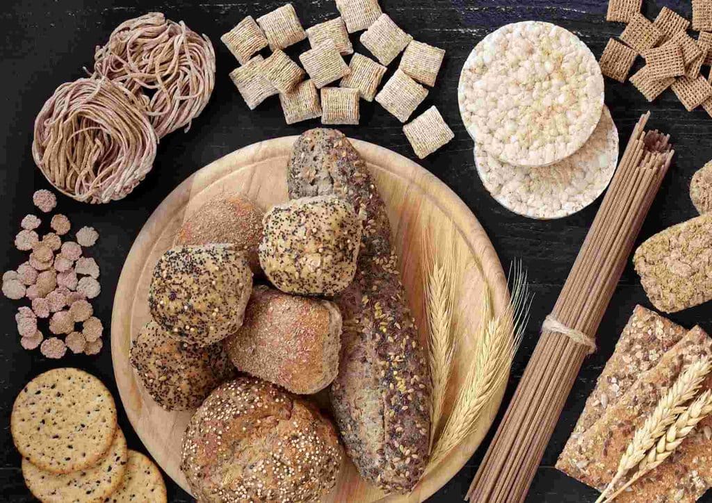 High Fibre Diet for Weight Loss: Why Fibre Keeps You Full 41 A person holding a handful of brown seeds, showcasing their texture and size against a neutral background.