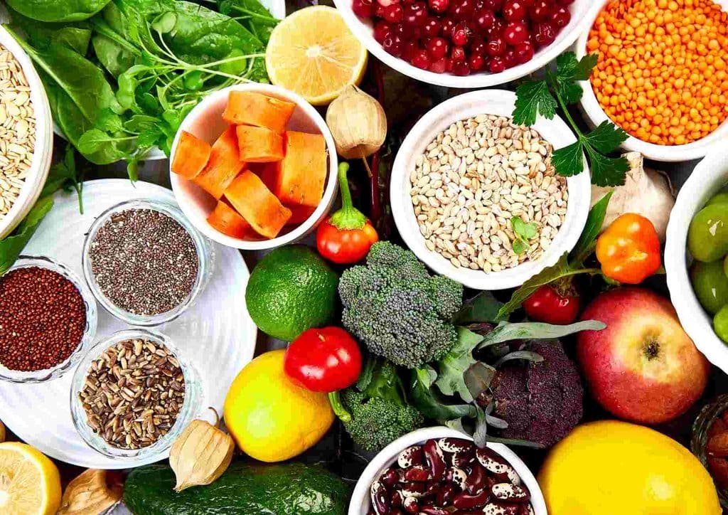 Losing Weight While Breastfeeding: What's Safe and Realistic 26 Bowls filled with an array of fresh fruits and vegetables, highlighting their vibrant colours and diverse textures.