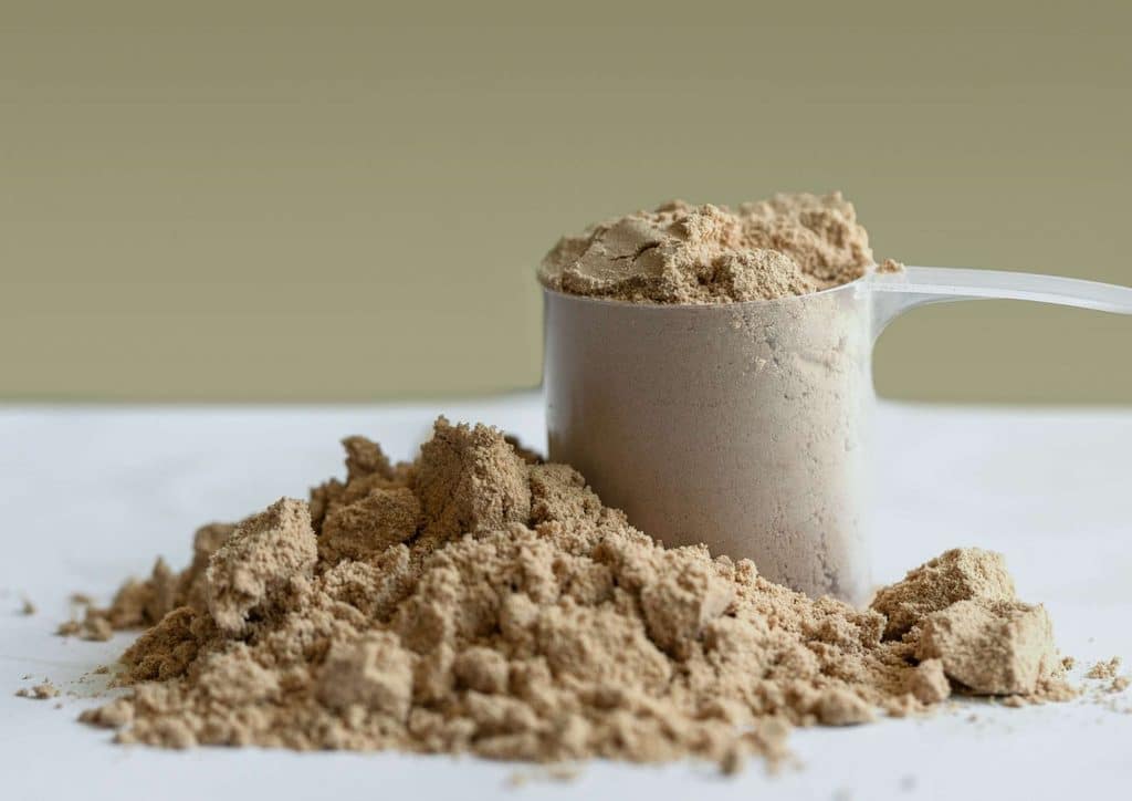 Is Whey Protein Good for Weight Loss? 28 Protein powder being poured into a blender, ready for mixing with other ingredients.