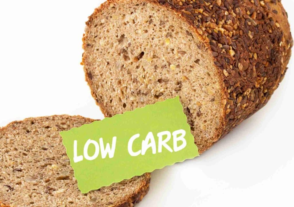 Keto vs Low Carb for Weight Loss: Which Is Better? 14 Low carb bread displayed with a green label, emphasising its health-conscious attributes.