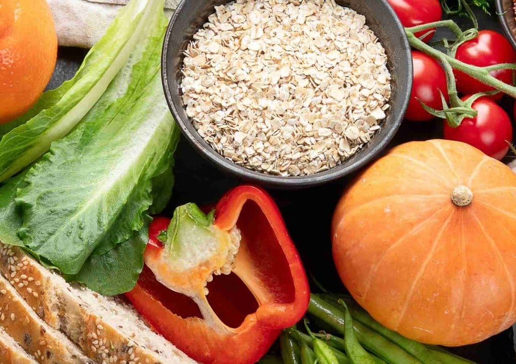 Keto vs Low Carb for Weight Loss: Which Is Better? 45 A diverse spread of foods including vibrant vegetables, artisanal bread, and assorted meats displayed together.
