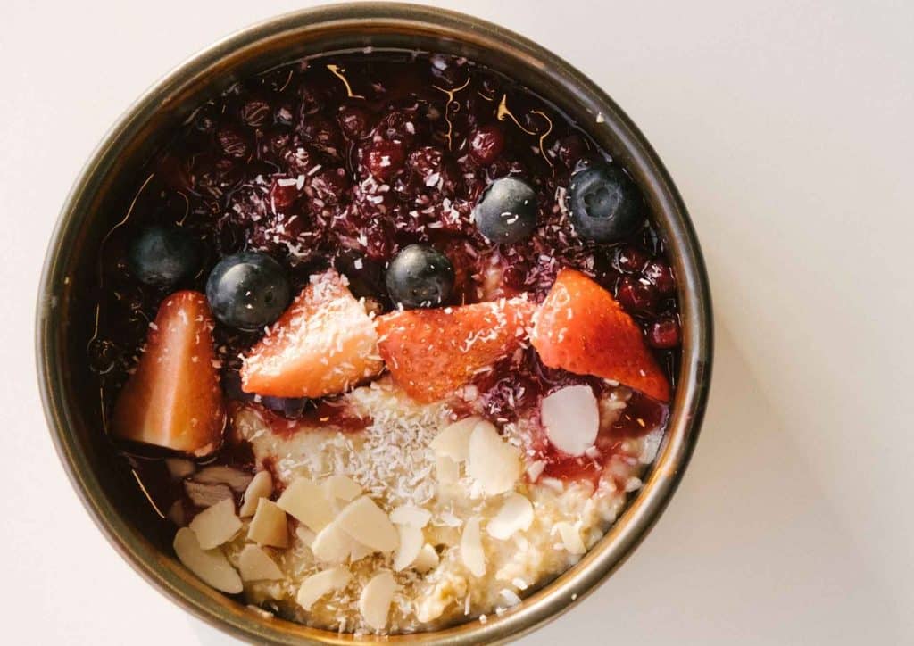 High Fibre Diet for Weight Loss: Why Fibre Keeps You Full 27 A metal container showcasing a vibrant mix of fresh berries and assorted nuts.