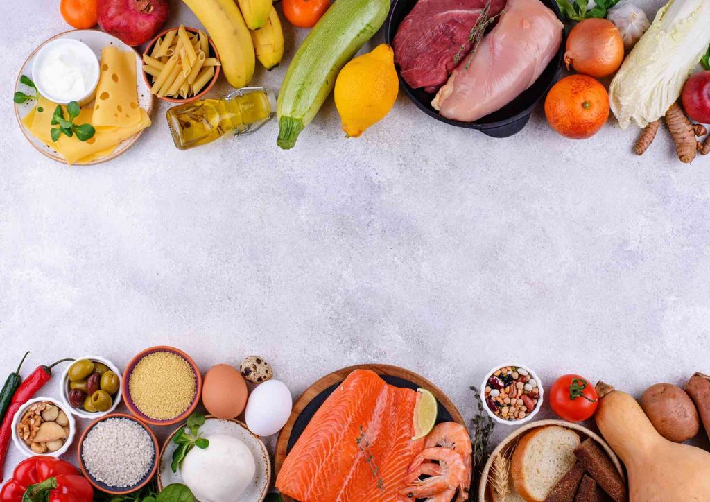 Is the Mediterranean Diet Good for Weight Loss? 21 A variety of foods, including fruits, vegetables, and grains, are artistically arranged within a decorative frame.