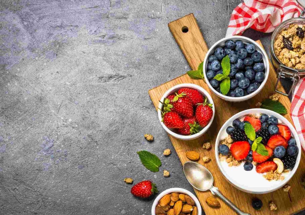Is the Mediterranean Diet Good for Weight Loss? 3 A circular arrangement of various healthy foods, including fruits, vegetables, nuts, and grains, promoting nutritious eating.