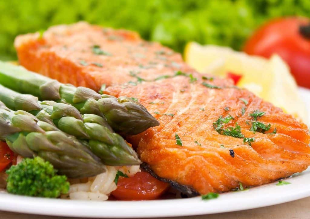 Healthy Lunches for Weight Loss: Work and Home Ideas 17 A plate featuring grilled salmon, steamed asparagus, and a serving of fluffy rice.