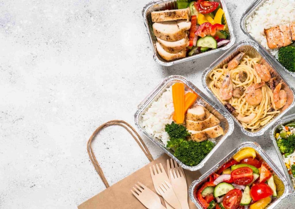 Healthy Lunches for Weight Loss: Work and Home Ideas 16 A selection of diverse foods displayed in aluminum containers, showcasing different colours and textures.