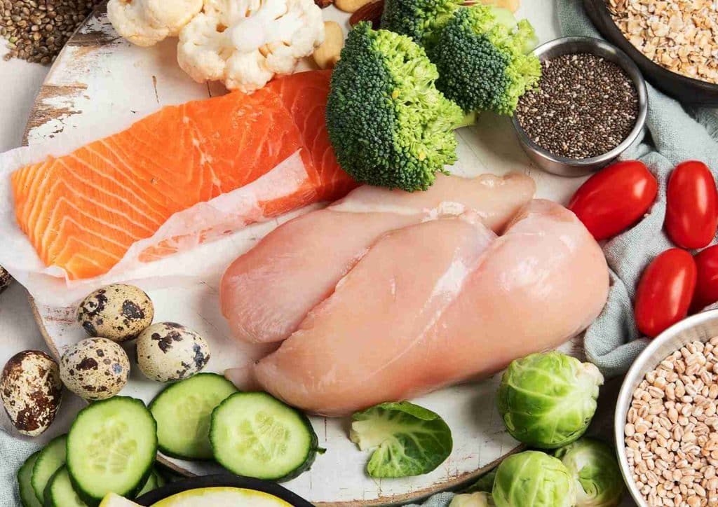 Healthy Lunches for Weight Loss: Work and Home Ideas 13 A variety of heart-healthy foods including fruits, vegetables, whole grains, nuts, and fish displayed on a wooden table.