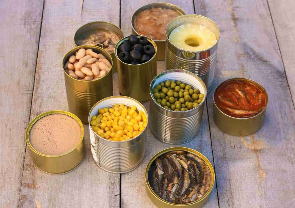Easy Meals for Weight Loss When You're Short on Time 19 A collection of assorted canned foods neatly arranged inside a larger can.