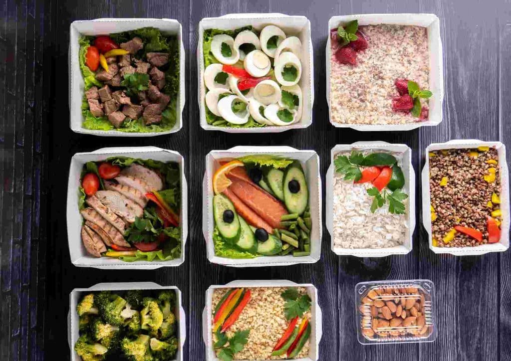 Healthy Lunches for Weight Loss: Work and Home Ideas 12 A selection of diverse foods arranged in clear plastic containers, showcasing various colors and textures.