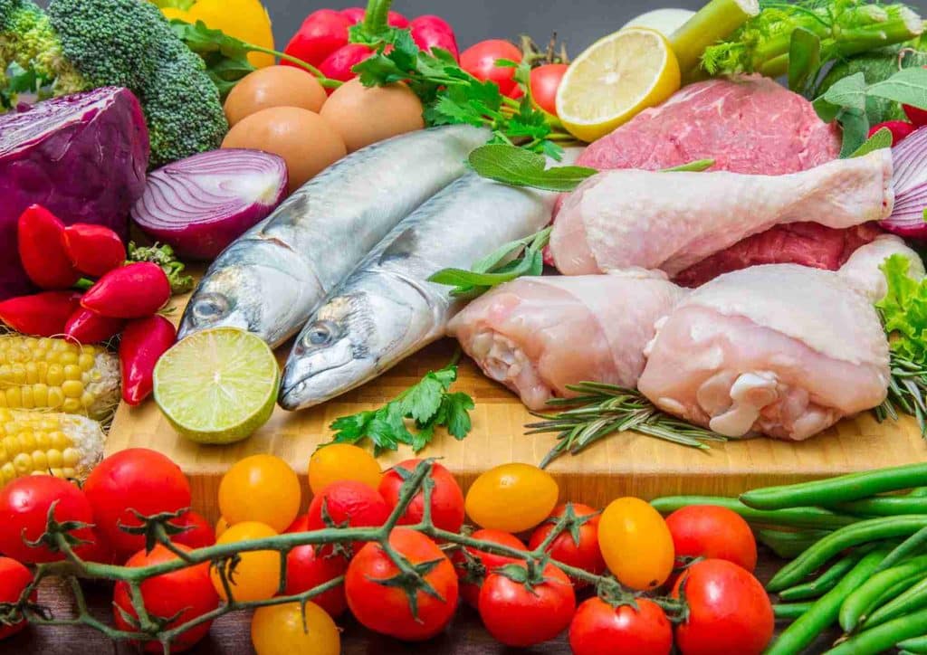 Is the Mediterranean Diet Good for Weight Loss? 5 A display of assorted fresh and frozen foods, including fruits, vegetables, and packaged meals.