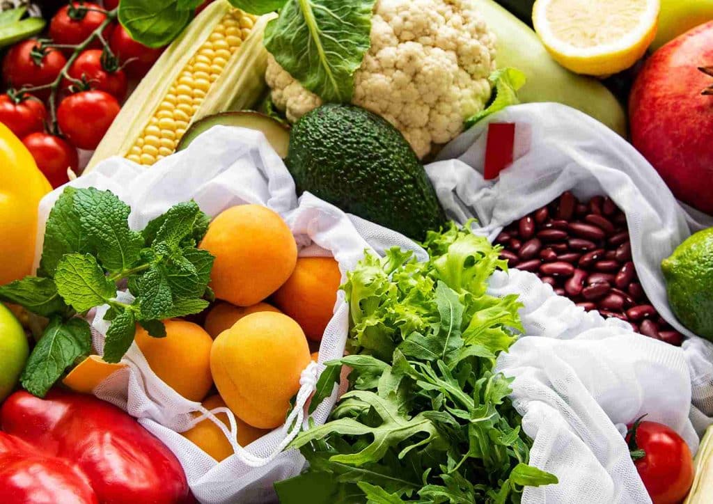 Losing Weight While Breastfeeding: What's Safe and Realistic 30 A woven basket overflowing with various fresh fruits and vegetables, highlighting their natural freshness and diversity.