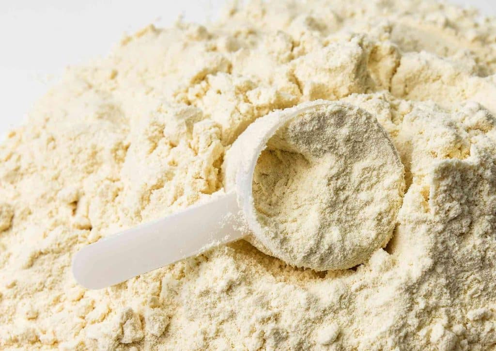 Is Whey Protein Good for Weight Loss? 17 A scoop of flour held by a spoon, showcasing its fine texture and white colour against a neutral background.