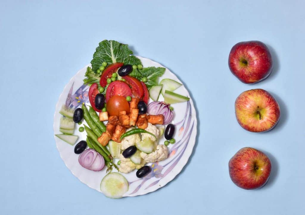 Is the Mediterranean Diet Good for Weight Loss? 11 Assorted nuts and dried fruits arranged in small bowls, highlighting their diverse shapes and natural hues.